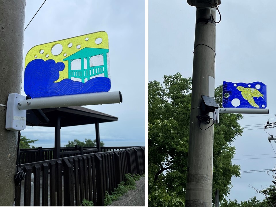 A colorful acrylic sign engraved with an image of Luiqui Island Tourist Spot