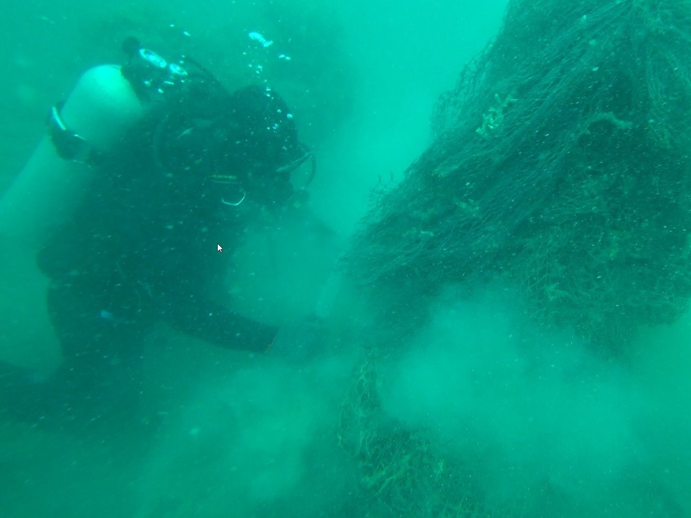 Another derelict fishing net that got stuck on rocks in deep waters was under the process to be removed.