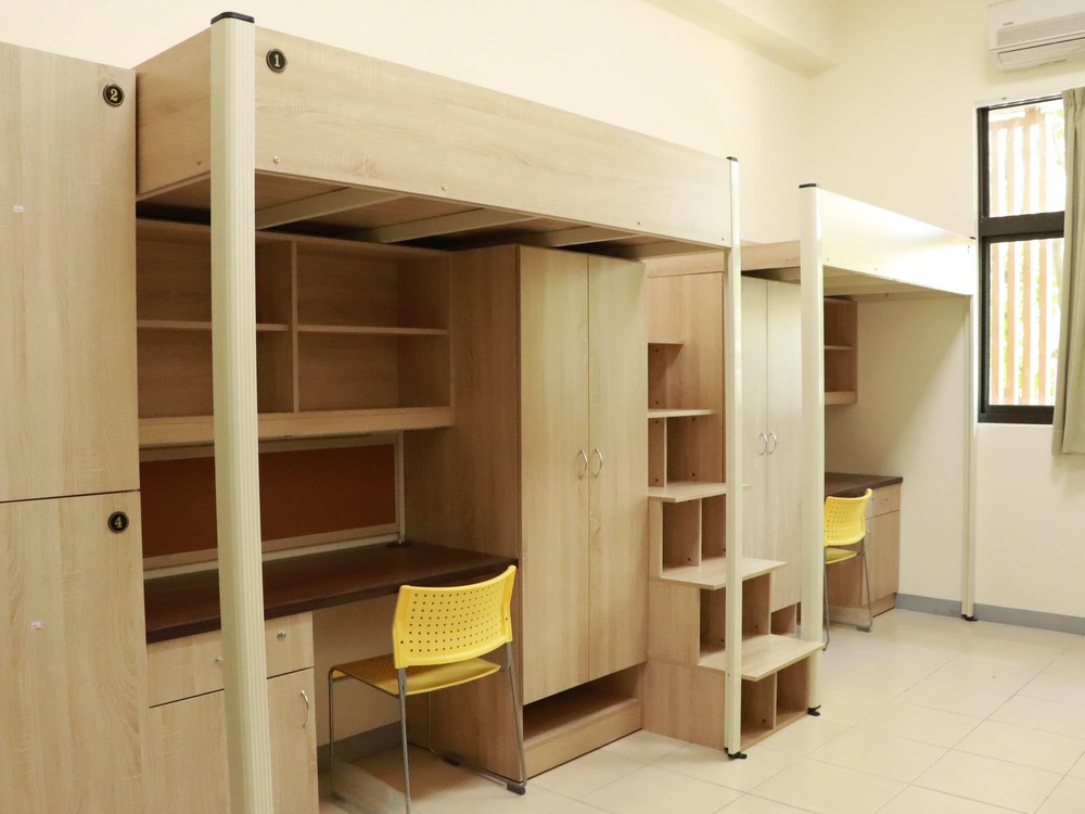 The 4-bed male dorm includes a set of a desk, a chair, a closet, a locker, and a bed.