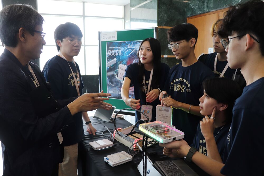 Pictured is the 2025 ICDC champion team, with their project "SOCIAL TAG." This year's camp theme, "The interactive devices to enhance and energize a party event," was highly fitting for university life scenarios, and each team's creativity was brilliant and truly spectacular. The person on the far left is Professor Takafuji, one of the judging professors delegated by Kumamoto University, Japan.